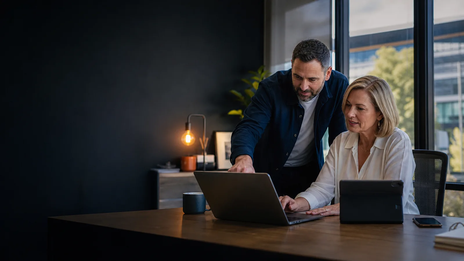 IT consultant helping a Melbourne small business owner with her technology