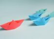 Paper Boats on Solid Surface