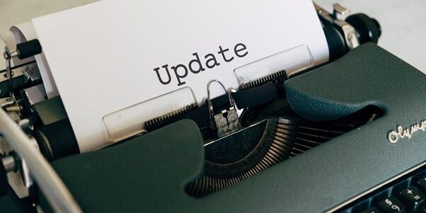 TTT_Blog-Is-Updating-From-Windows-10-to-11-Worth-It-Featured-Image.jpg white printer paper on green typewriter