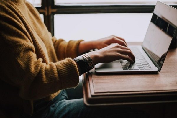 TTT_Blog-What-Is-an-MSP-Featured-Image.jpg person sitting front of laptop