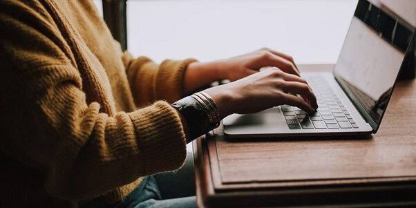 TTT_Blog-What-Is-an-MSP-Featured-Image.jpg person sitting front of laptop