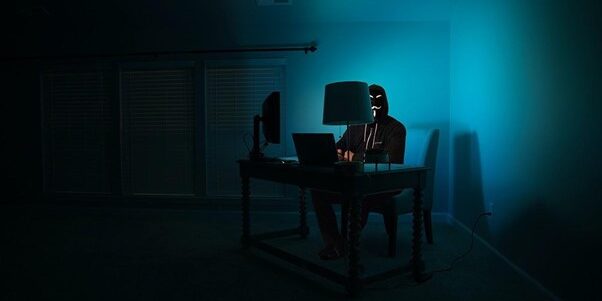 TTT_Blog-Which-Type-of-Hacker-is-Endangering-Your-Business-Data-Featured-Image.jpg man siting facing laptop