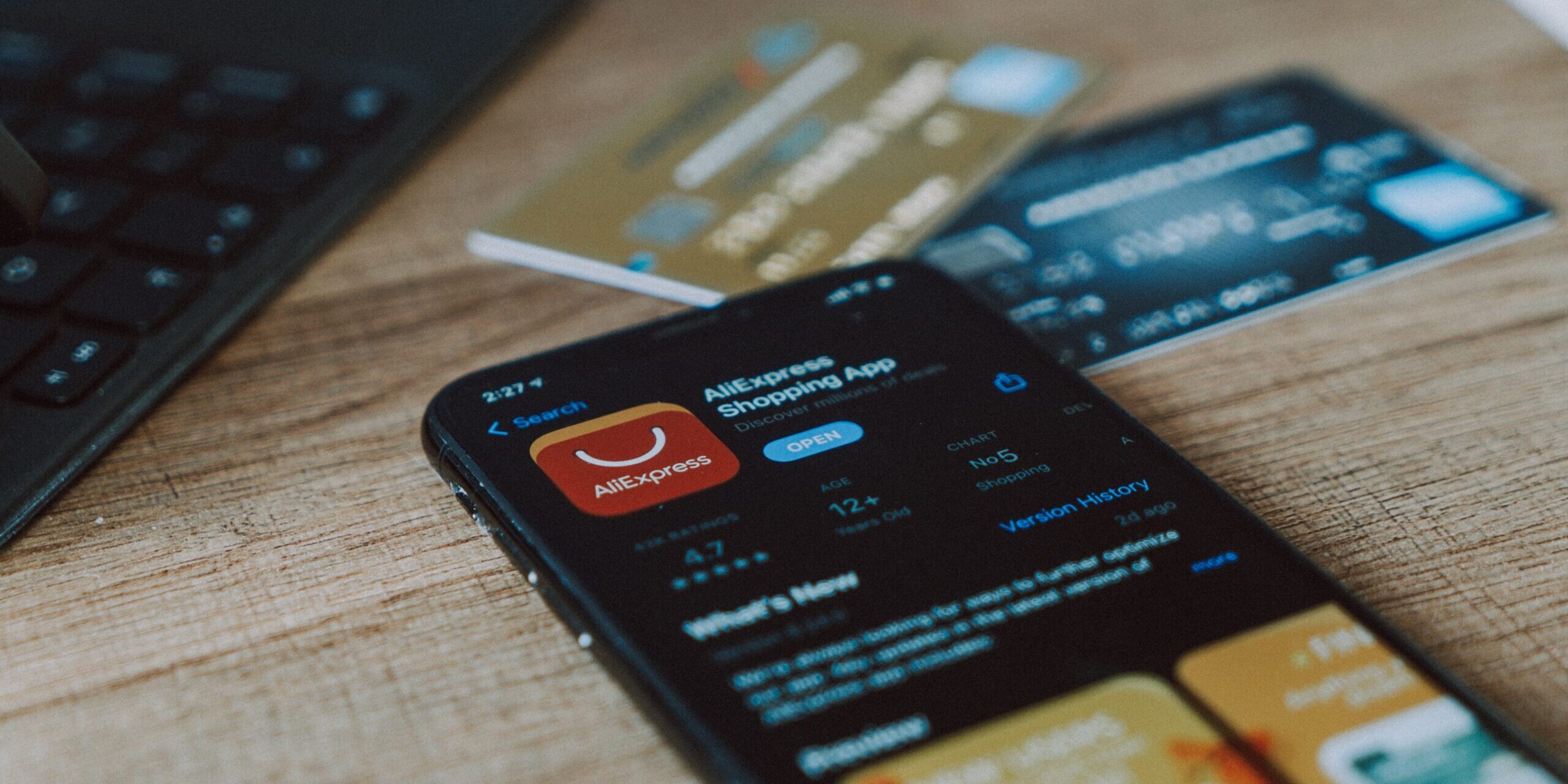 Is-Your-Online-Shopping-App-Invading-Your-Privacy-scaled.jpg black and orange card on brown wooden table