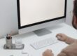 Free Crop man working on computer in workplace Stock Photo