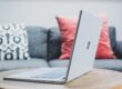 macbook pro on white couch