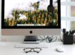 Free Turned on Silver Imac With Might Mouse and Keyboard Stock Photo