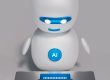 a white robot sitting on top of a table