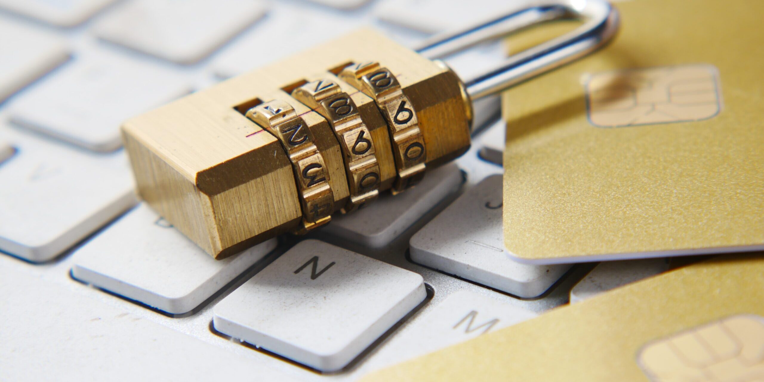Need-to-Show-the-Tangible-Value-of-Cybersecurity-Heres-How-scaled.jpg a golden padlock sitting on top of a keyboard