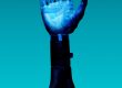 alt="Free Prosthetic Arm on Blue Background Stock Photo"