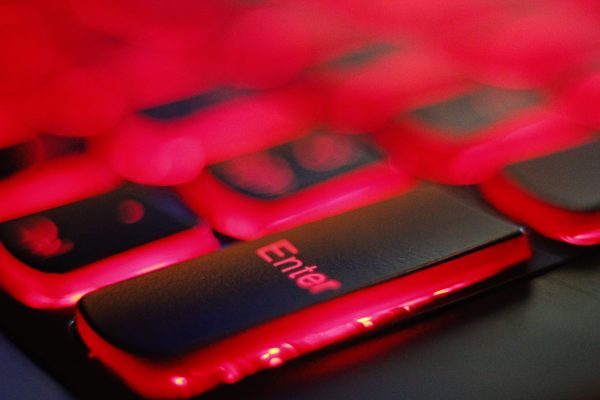 Online-Security-Addressing-the-Dangers-of-Browser-Extensions-scaled.jpg a close up of a red and black keyboard
